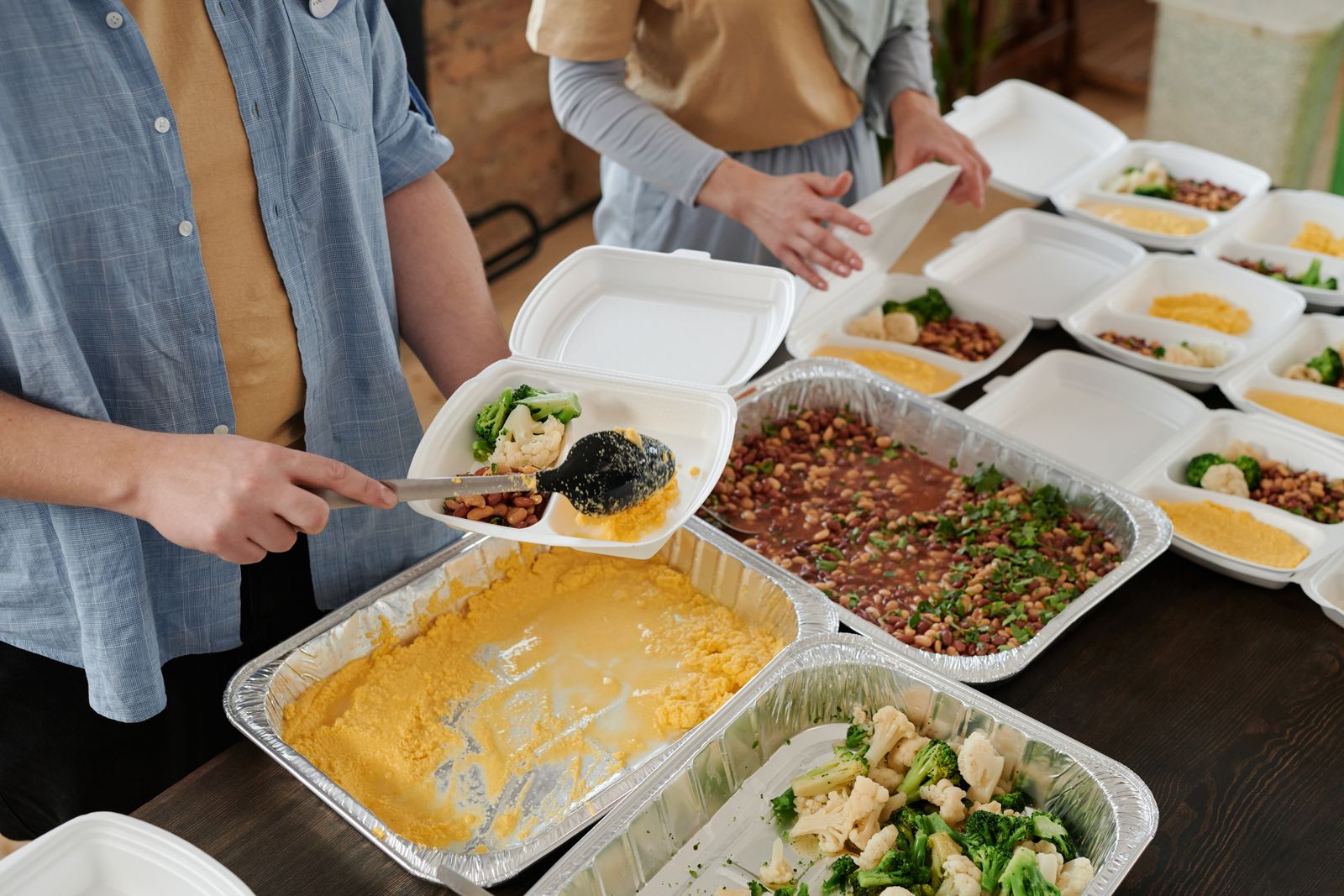 Volunteers preparing colourful nourishing meals for distribution